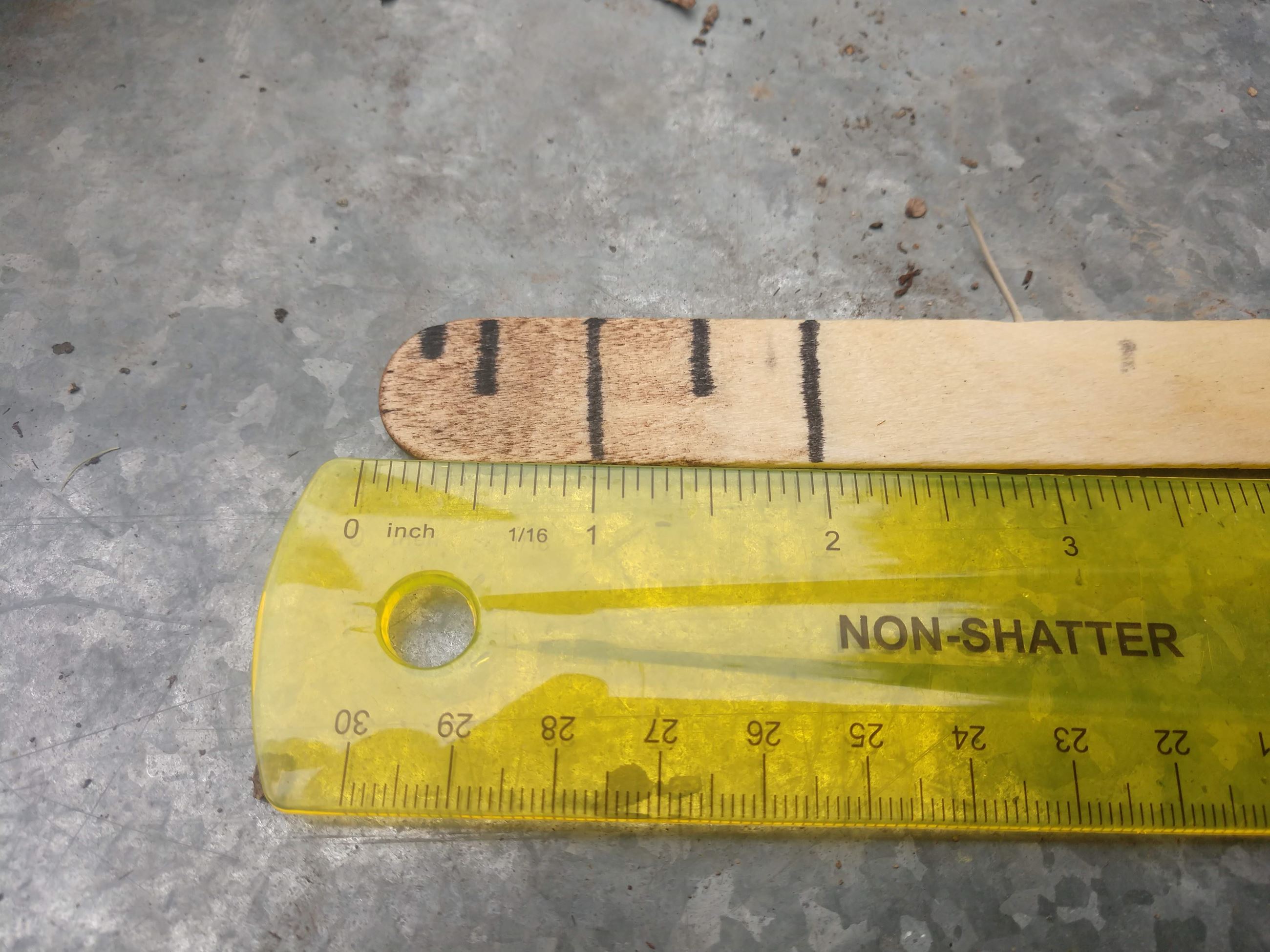 Mark a stick with depth measurements