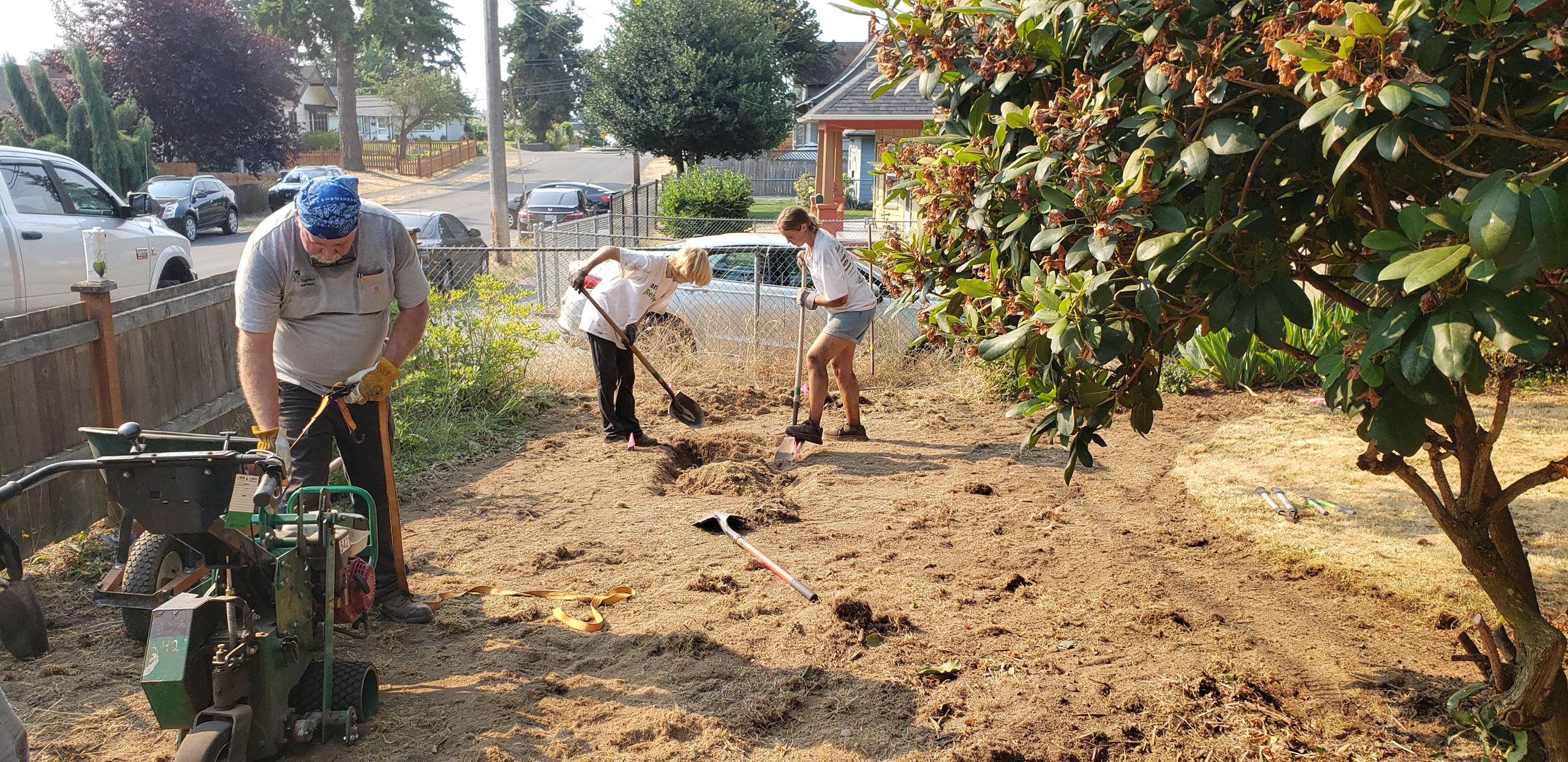 A group of people building a rain garden 