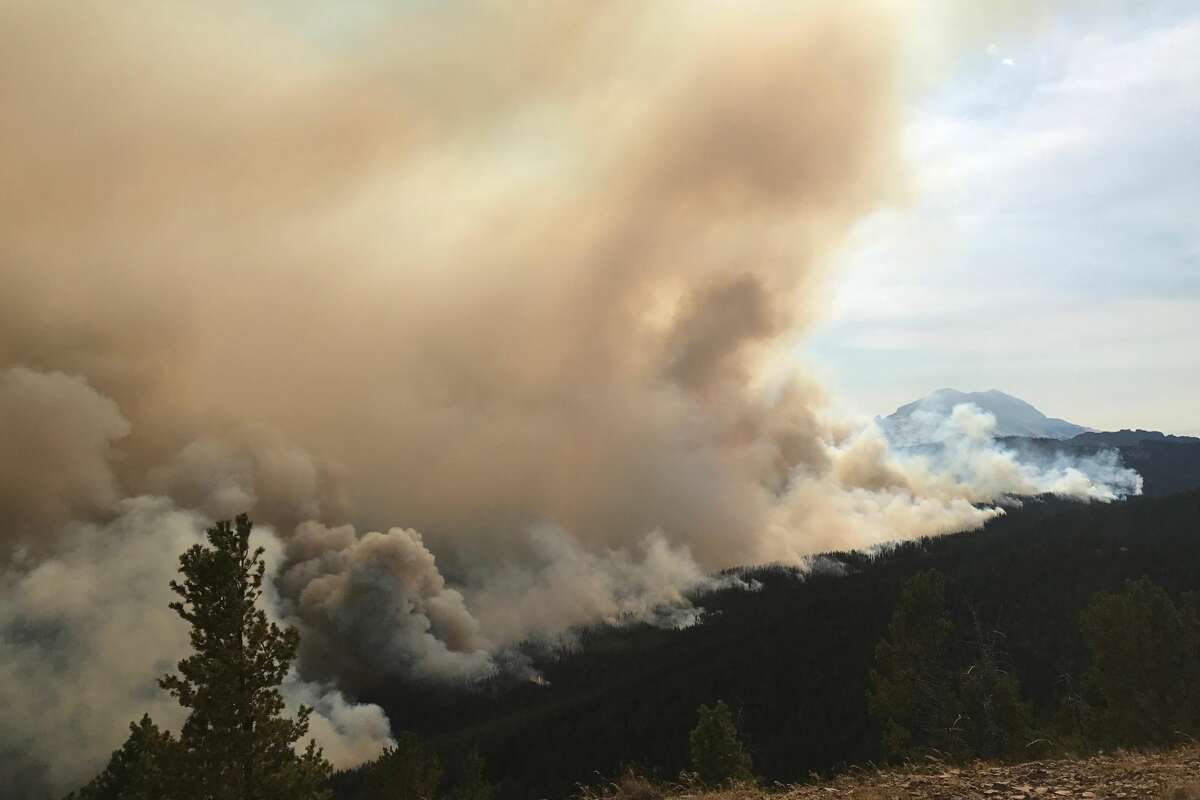 Norse Peak on fire in 2017. Smoke takes up over half of the picture.