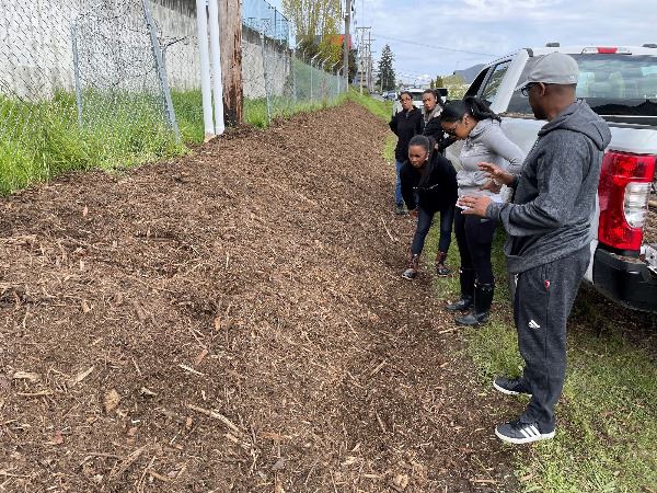The Oasis of Hope uses their mini-grant to remove invasive blackberries and create a rain garden.