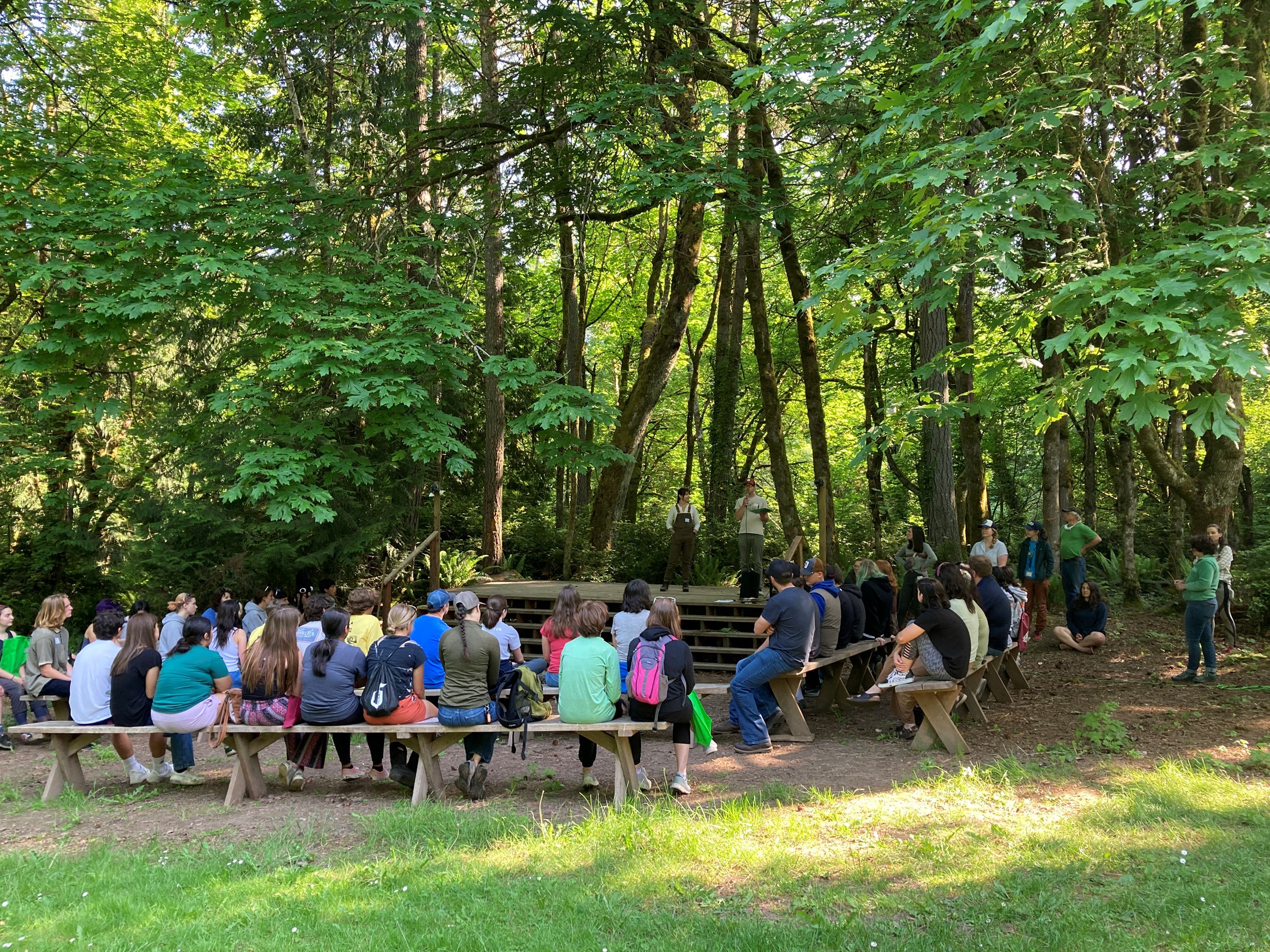 Students gather at the camp's amphitheater for a trivia competition.