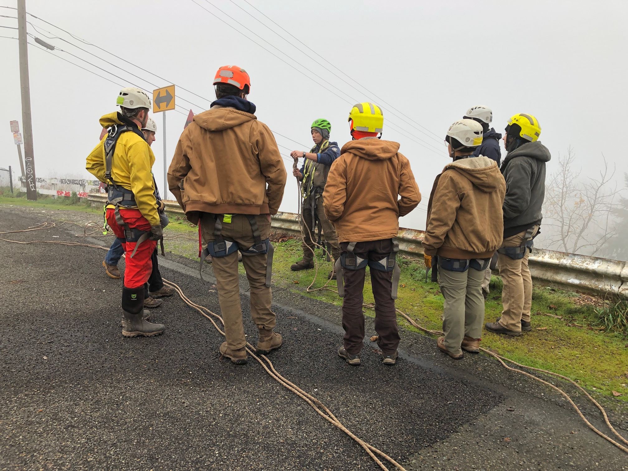 Crew supervisor Dan Nakamura demonstrating knots for the team assembled.