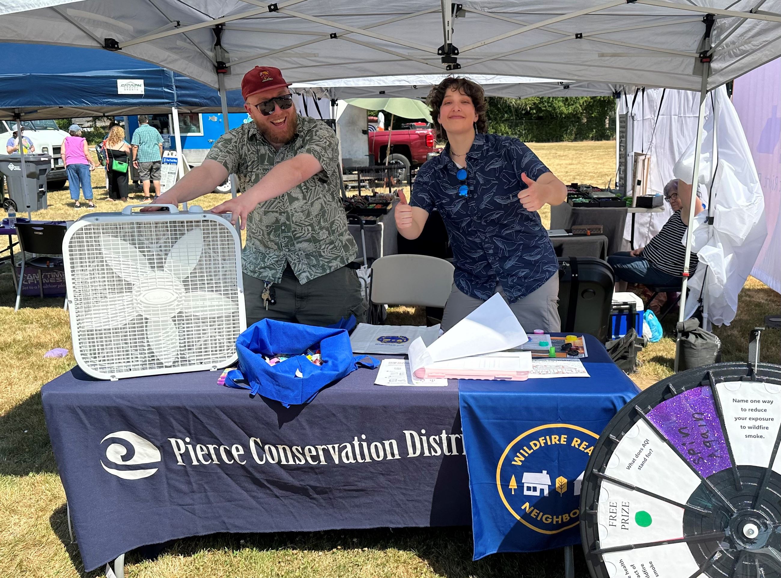 James and Lael giving away box fan filters at the Edgewood Community Picnic