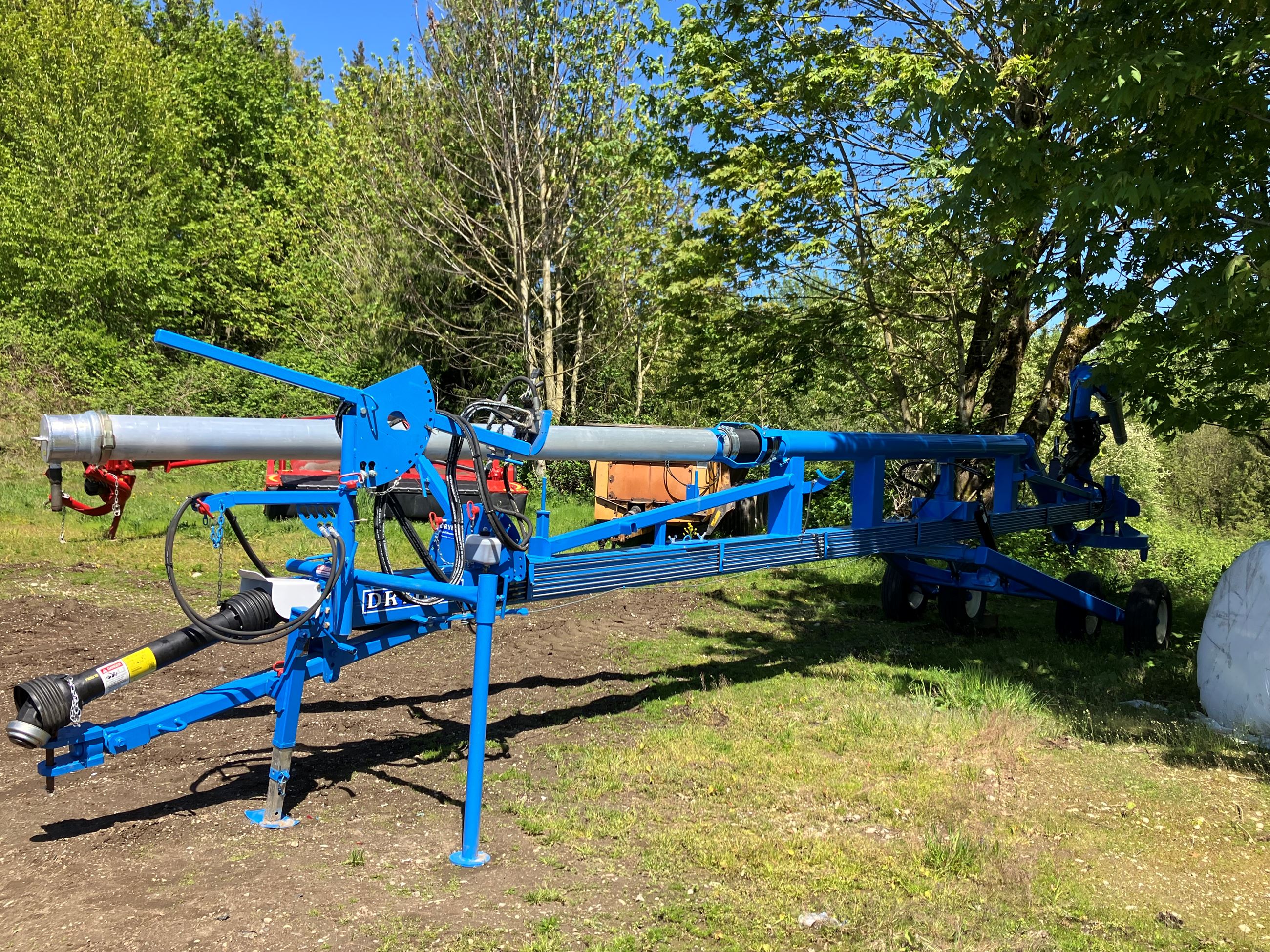 Blue colored lagoon pump on Ryan's farm
