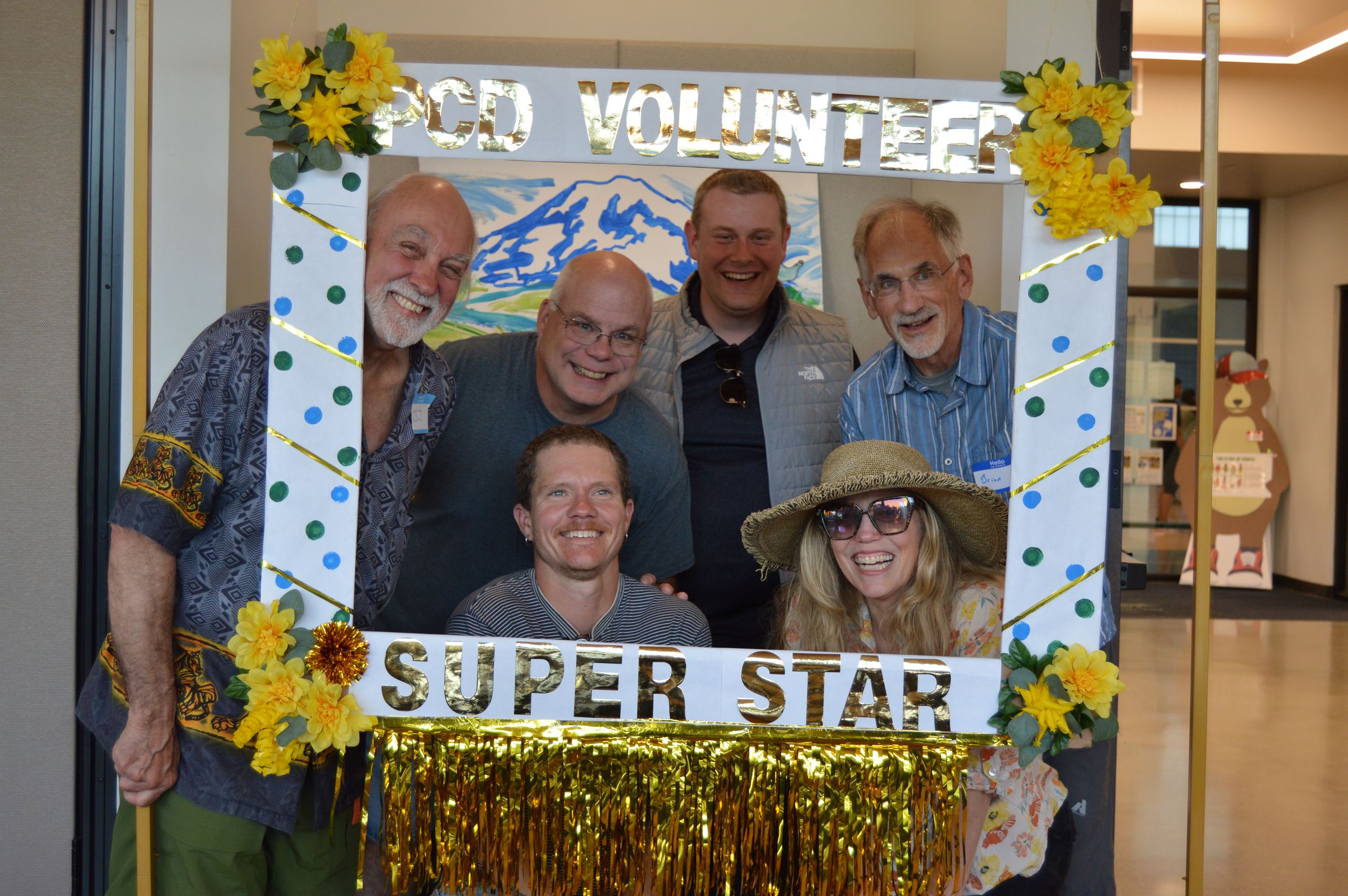 Board of Supervisors take a group picture at photobooth