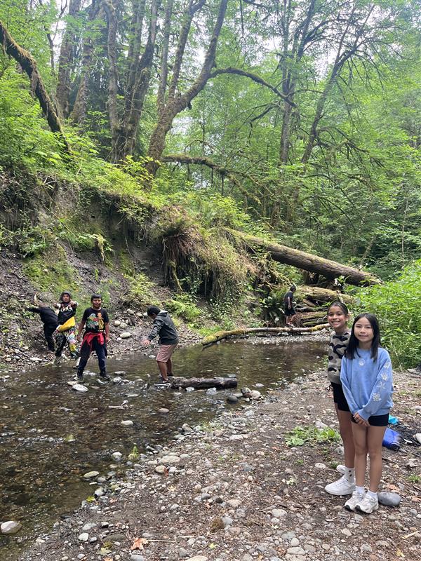 Students explore the stream at Swan Creek Park