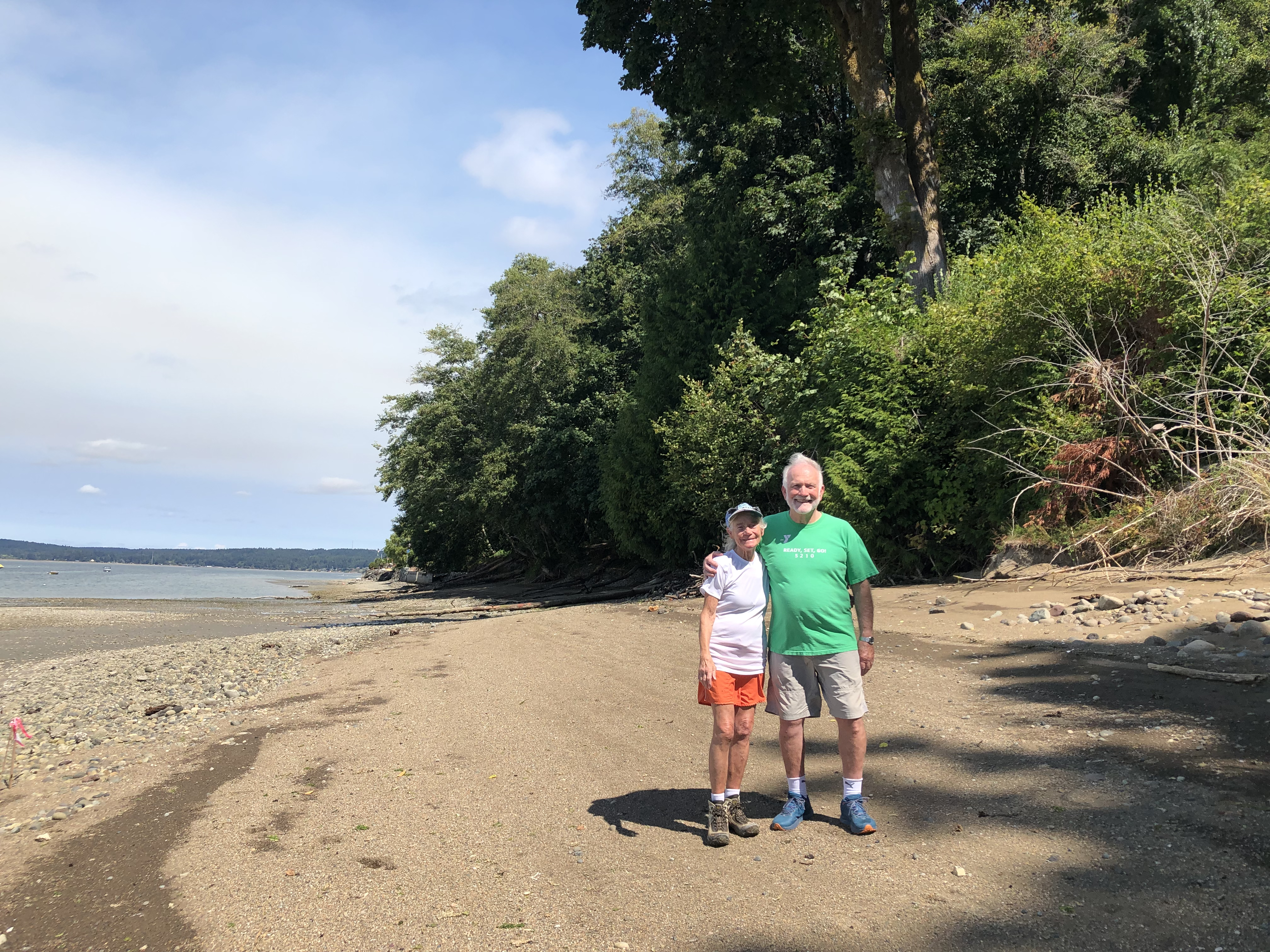 Landowners, Pam Boyles and Roger Johnson, standing on their restored beach. 